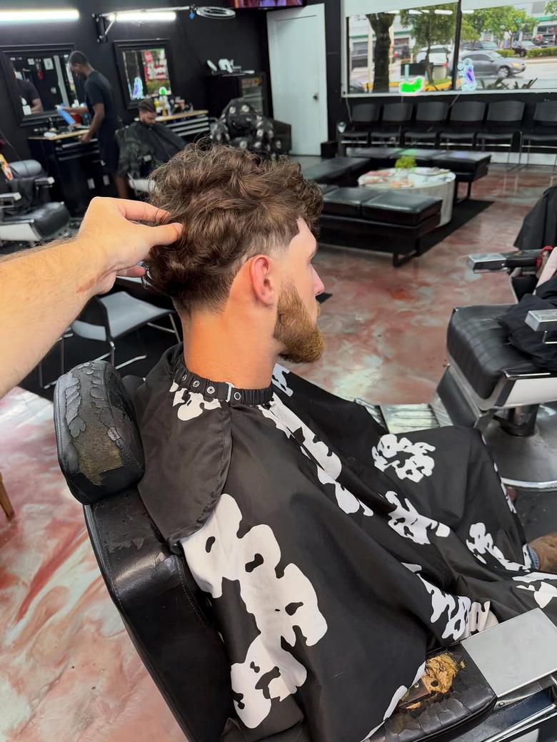 Client after a curly cut with a shaped beard