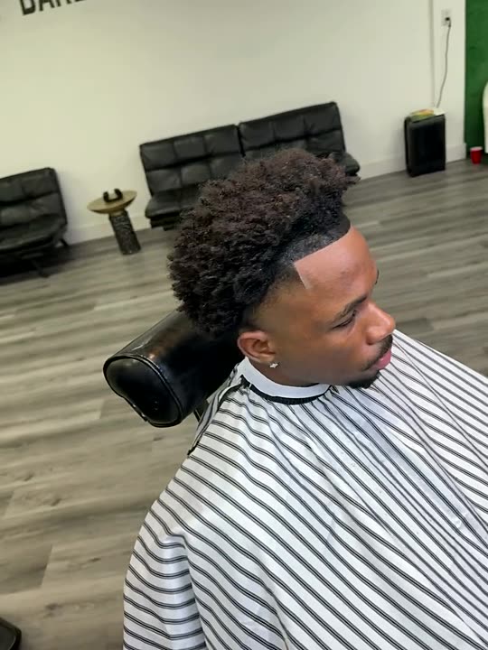 High top curls with a sharp fade